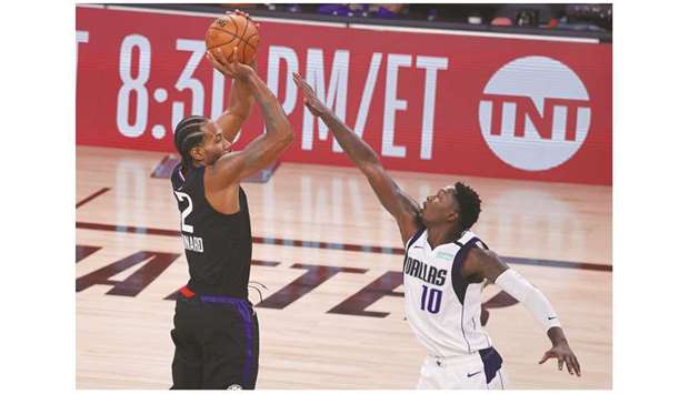 Kawhi Leonard of the LA Clippers handles the ball against the Dallas