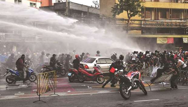 Police fire water cannon at pro-democracy protesters during a protest calling for the resignation of Prime Minister Prayut Chan-o-cha over the Thai governmentu2019s handling of the Covid-19 crisis, in Bangkok yesterday.