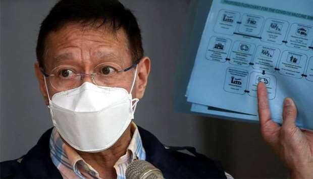 (File photo) Philippine Health Secretary Francisco Duque holds a flowchart for the COVID-19 vaccine simulation during a press briefing at the Research Institute for Tropical Medicine in Muntinlupa, Metro Manila, Philippines on February 9, 2021. (REUTERS)