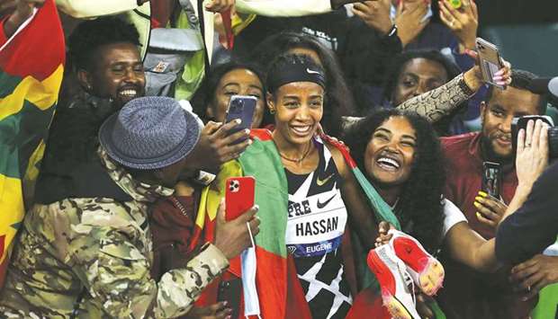 Sifan Hassan of the Netherlands celebrates with fans after winning 5,000m race during the 2021 Prefontaine Classic at Hayward Field in Eugene, Oregon. (Getty Images/AFP)