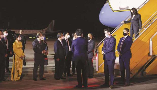 US Vice President Kamala Harris is received by Le Khanh Hai, chairman of the Office of State President, Nguyen Quoc Dung, MFA Vice Minister and Nguyen Vu Ha Le, director general of foreign affairs, as she arrives for the second leg of her Asia trip, in Hanoi, Vietnam, yesterday.