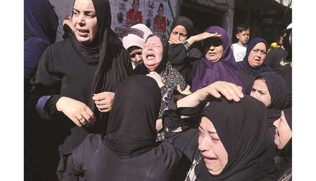 Relatives mourn during the funeral of 15-year-old Palestinian Imad Khaled Saleh Hashash at the Balata refugee camp, in the north of the occupied West Bank yesterday.