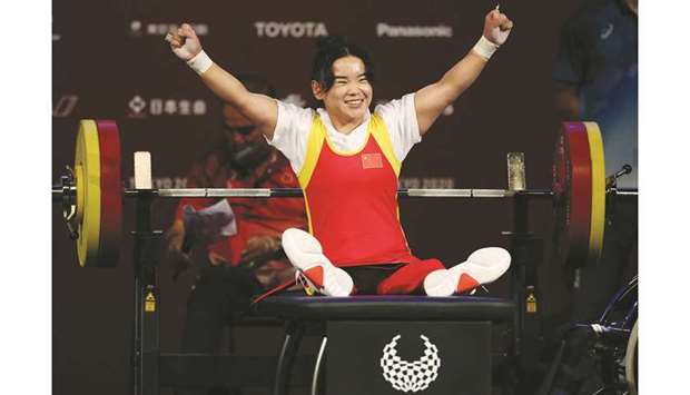 Guo Lingling of China celebrates her win in the womenu2019s -41kg powerlifting final during the Tokyo Paralympics at Tokyo International Forum yesterday. (Reuters)