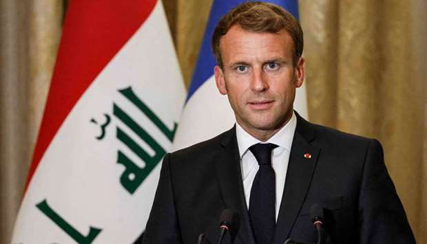 French President Emmanuel Macron holds a press conference at the guest house in the Iraqi capital Baghdad on August 28, 2021.