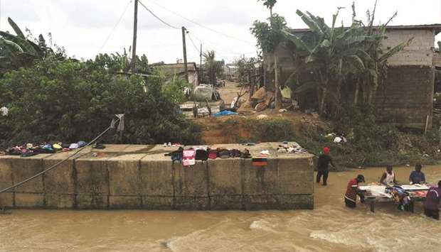 People dry items in the Makepe-Missoke neighbourhood of Douala, Cameroon.