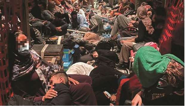 Afghan evacuees sit inside one of Italyu2019s last military aircraft, C130J, to fly out of Kabul airport yesterday. (Reuters)