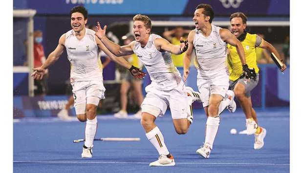 Belgium players celebrate after winning the penalty shoot-out against Australia in the Tokyo Olympics hockey final at the Oi Hockey Stadium in Tokyo yesterday. (Reuters)