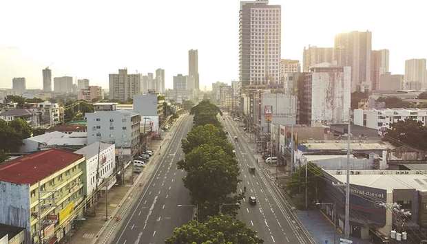 Minimal traffic is visible on a main thoroughfare in Quezon City, during a two-week lockdown following a surge in Covid cases, in Metro Manila yesterday.