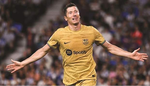 Barcelonau2019s Robert Lewandowski celebrates after scoring his teamu2019s third goal during the La Liga match against Real Sociedad at the Anoeta stadium in San Sebastian, Spain, on Sunday. (AFP)