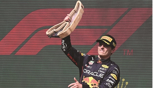 Red Bull Racingu2019s Dutch driver Max Verstappen celebrates his victory during the podium ceremony of the Belgian Formula One Grand Prix at the Spa-Francophones Racetrack at Spa in Belgium yesterday. (AFP)