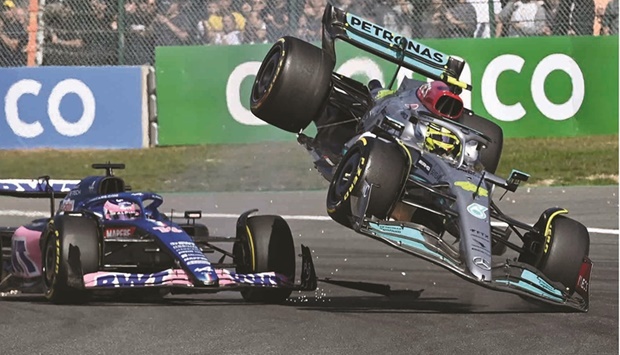 Mercedesu2019 British driver Lewis Hamilton (right) collides with Alpineu2019s Spanish driver Fernando Alonso during the Belgian Formula One Grand Prix at Spa-Francophones racetrack at Spa on Sunday. (AFP)