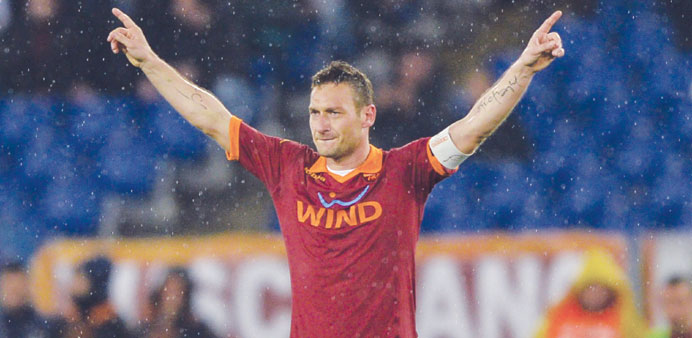 AS Roma forward Francesco Totti celebrates after scoring against Parma during their Italian Serie A match at Romeu2019s Olympic stadium on Sunday. (AFP)