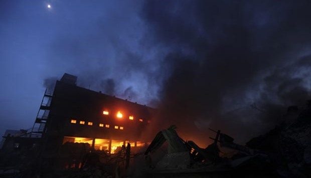 Smoke and flames billow from a burning factory in Tongi, in the key Bangladeshi garment manufacturing hub of Gazipur, on Saturday.