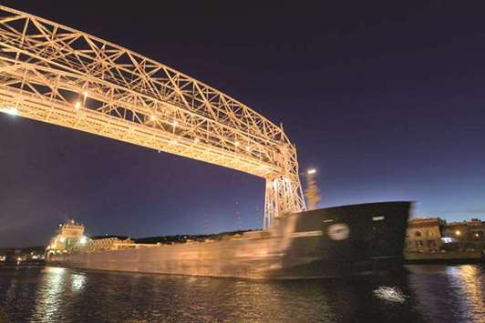 SAILING: A freighter sails under the Lift Bridge in Duluth, Minn.