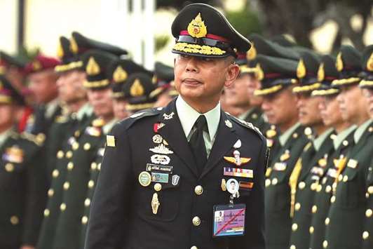 Thailandu2019s new Royal Army Chief General Apirat Kongsompong participates in the handover ceremony at the Thai Army headquarters in Bangkok yesterday.