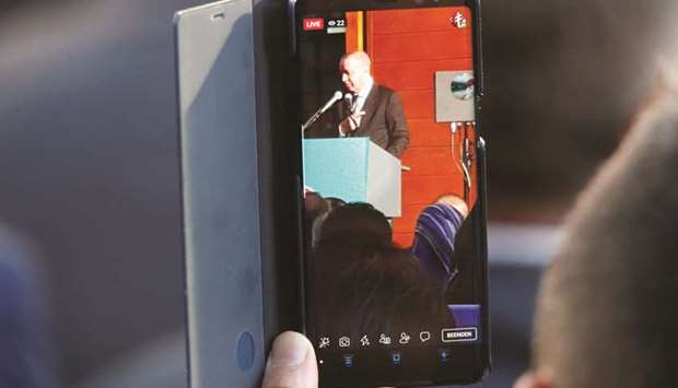 A man records Erdoganu2019s speech at the official inauguration of the Cologne Central Mosque in Cologne.