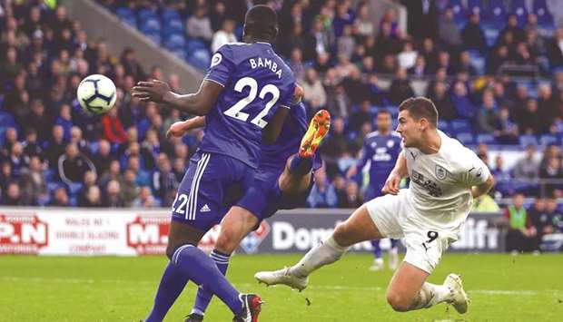 Burnleyu2019s striker Sam Vokes (right) scores his teamu2019s second goal against Cardiff City in the English Premier League match at Cardiff City Stadium in Cardiff, south Wales, yesterday. (AFP)