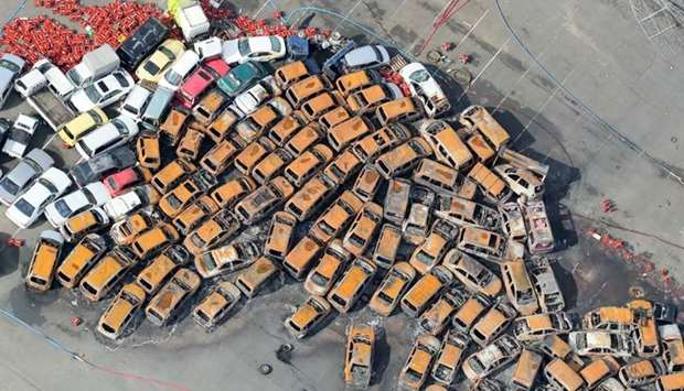 An aerial view from a Jiji Press helicopter shows passenger vehicles which were burnt after a storm surge and strong winds caused by typhoon Jebi in Nishinomiya, Hyogo prefecture.