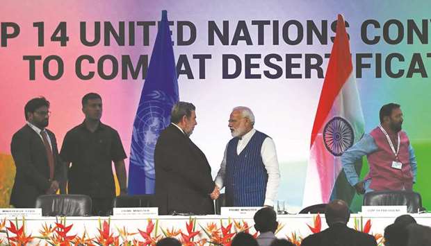 Prime Minister Narendra Modi shakes hands with Prime Minister of Saint Vincent and the Grenadines Ralph Gonsalves during the United Nations Convention to Combat Desertification (UNCCD) in Greater Noida yesterday.