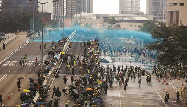 Hong Kong Police Fire Tear Gas, Water Cannon At Protesters - Gulf Times