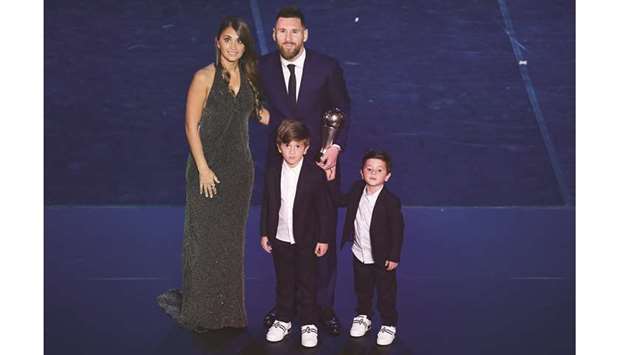 Best FIFA Menu2019s Player of 2019, Argentina and Barcelona forward Lionel Messi poses with his wife Antonella Roccuzzo and their children after the awards ceremony in Milan on Monday night. (AFP)