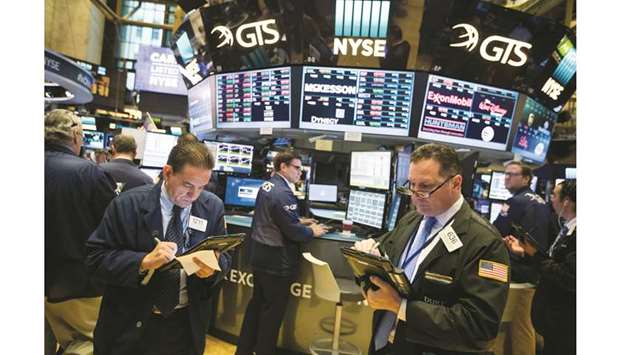 Traders work on the floor of the New York Stock Exchange. US market participants will get a picture of the extent to which trade tensions and currency have hurt US  manufacturers when the Institute for Supply Management releases its purchasing managers index for September on Tuesday.