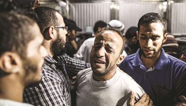 The father of a Palestinian who was killed during clashes following a demonstration at the Israeli-Gaza border fence, reacts at Al-Shifa hospital in Gaza City, yesterday.