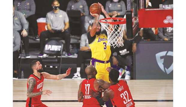 Los Angeles Lakers forward Anthony Davis (top) shoots against Houston Rockets during game four of the second round of the 2020 NBA Playoffs at AdventHealth Arena in Lake Buena Vista, Florida, United States, on Thursday. (USA TODAY Sports)