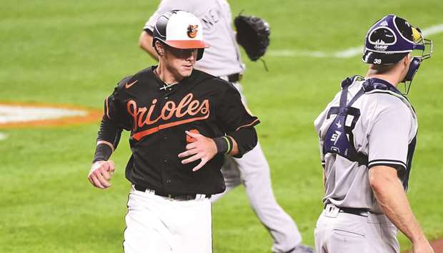 Orioles win early, lose late in season-ending doubleheader