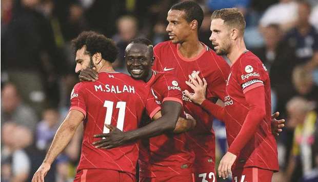 Liverpoolu2019s Sadio Mane (second left) celebrates with teammates after scoring against Leeds during the Premier League match at Elland Road in Leeds, northern England. (AFP)