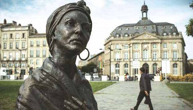 This photograph taken yesterday in Bordeaux shows a statue depicting Modeste Testas, a slave who was bought by two brothers from Bordeaux in the 18th century, then manumitted.