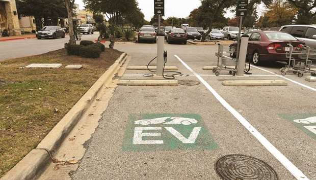 An electric vehicle (EV) fast charging station is seen in the parking lot of a Whole Foods Market in Austin, Texas.  (Reuters)