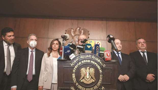 Secretary-General of the Syrian-Lebanese Higher Council, Nasri Khouri, speaks during a joint press conference with Syrian Foreign Minister Faisal Miqdad (second right) and other cabinet members alongside his Lebanese counterpart Zeina Akar (third left) leading an official delegation, following a meeting in the capital Damascus, yesterday.