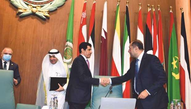 Qatar's Salem Mubarak al-Shafi hands over Arab League presidency to Kuwait's Ahmad Abdul Rahman al-Baker.