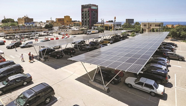 Solar panels cover a shopping mallu2019s parking lot in the city of Byblos in northern Lebanon. The countryu2019s economy collapsed in 2019 after decades of corruption and mismanagement, leaving the state unable to provide electricity for more than an hour or two. Last winter, the mountain village barely had three hours of daily generator electricity. Solar power now helps keep the lights on for 17 hours, an engineer working on the project said.