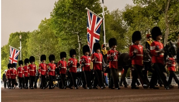 The cortege makes its way on The Mall in a nighttime rehearsal for when the coffin will be moved from Buckingham Palace to Westminster Hall, where Britain's Queen Elizabeth will lie in state for four days, following her death, in London. REUTERS