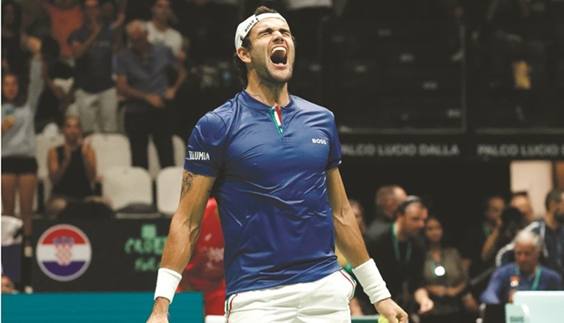 Italyu2019s Matteo Berrettini celebrates winning his match against Croatiau2019s Borna Coric during their Davis Cup, Group A, clash at Unipol Arena, Bologna, Italy, yesterday. (Reuters)