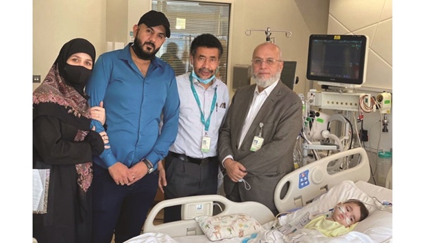 A SMA patient and family with Dr Khaled Omer Ibrahim and Dr Mahmoud Fawzi.