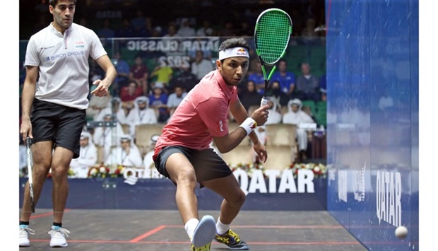 Qataru2019s Abdullah al-Tamimi (right) in action against Indiau2019s Ramit Tandon during their first round match of the QTerminals Qatar Classic 2022 squash tournament at the Khalifa International Tennis and Squash Complex in Doha on Sunday.