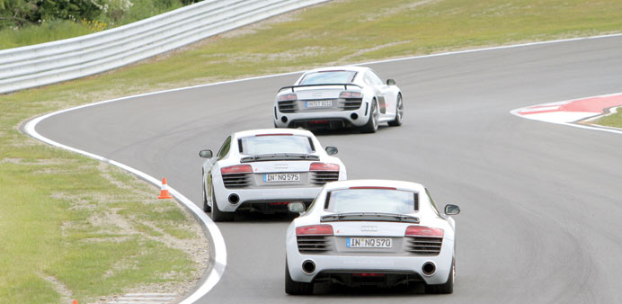 * Audi R8 sports-cars race around the circuit at the new Bilster Berg Drive Resort in northern Germany.