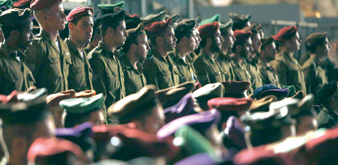 Israeli soldiers stand during a ceremony marking Memorial Day at the Western Wall in Jerusalemu2019s Old City yesterday.