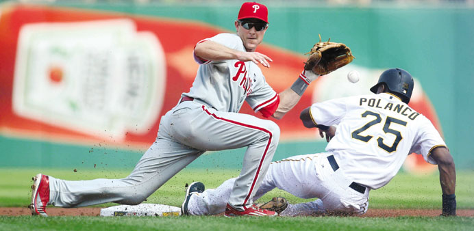 Philadelphia Phillies second baseman Chase Utley is congratulated