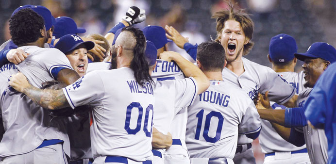 Clayton Kershaw gets first major league save as Dodgers clinch