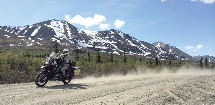   BIKING: Chris Day churns up dust on the Denali Highway of Alaska. 