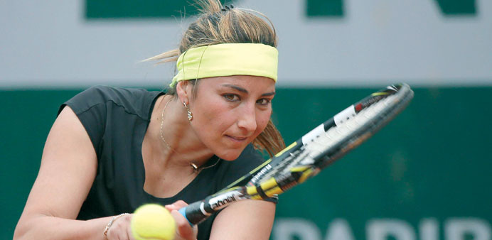 Franceu2019s Aravane Rezai hits a shot to Czech Republicu2019s Petra Kvitova during their French Tennis Open match at the Roland Garros stadium in Paris. (AFP