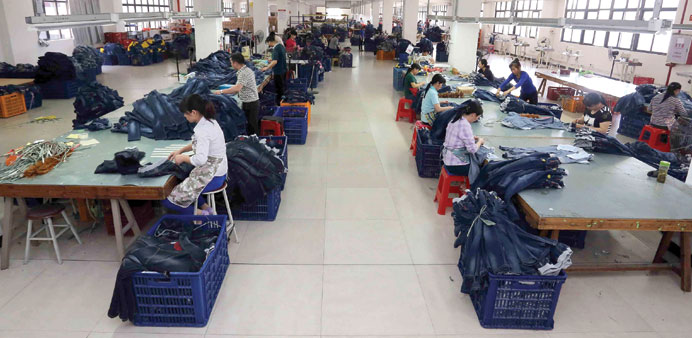 Chinese workers making jeans at a clothing factory in Shishi, east Chinau2019s Fujian province.