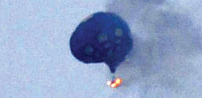 A hot air balloon on fire in north of Richmond, Virginia, on Friday.