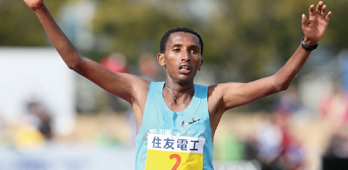 Ethiopiau2019s Bazu Worku crosses the finish line of the Lake Biwa marathon at Ojiyama Stadium in Otsu yesterday. Worku won the event with a time of 2:09: