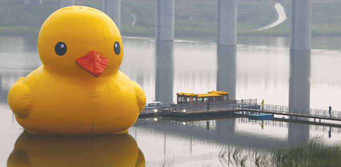 An inflated Rubber Duck by Dutch conceptual artist Florentijn Hofman is seen floating on a lake at the venue of the 9th China International Garden Exp