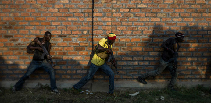 Members of the former Central African Armed Forces (FACA) and anti-balaka militia take part in a drill in the suburbs of Bangui, yesterday. Anti-balak